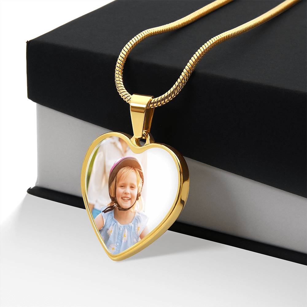 Gold finish photo heart pendant draped over a black gift box | Custom Photo Heart Necklace with Engraving