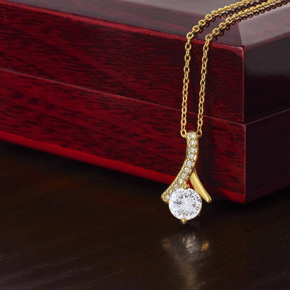 Yellow gold finish pendant draped over the mahogany Luxury Box | Proud Mom Necklace