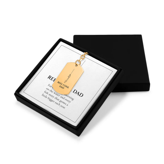Reel Cool Dad keychain in an open gift box with message card