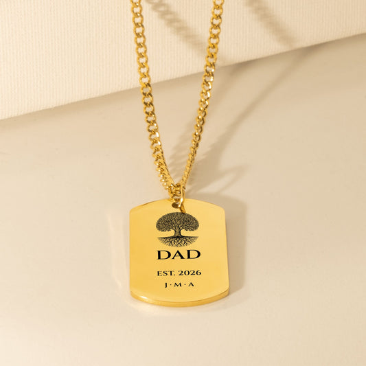 Gold Cuban chain dog tag engraved with an oak tree, DAD, EST. 2026 and initials