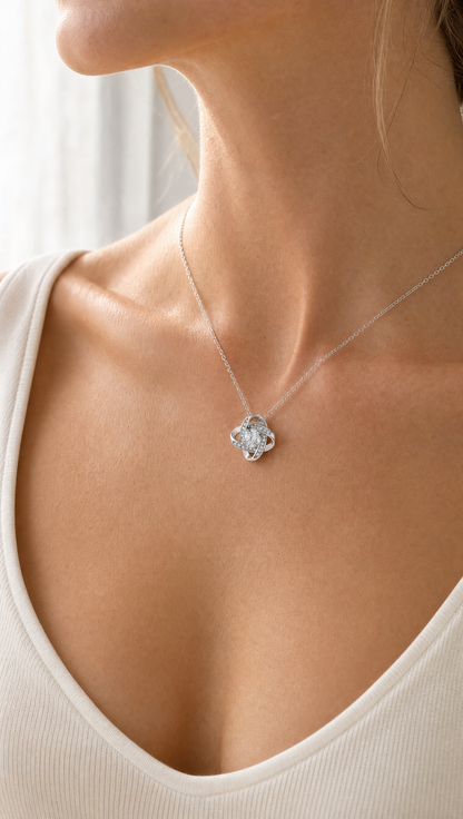 Woman wearing the Love Knot pendant necklace