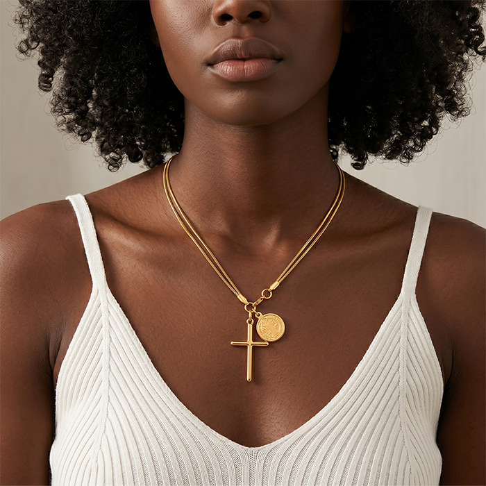 Gold snake chain detail on the St Benedict cross necklace