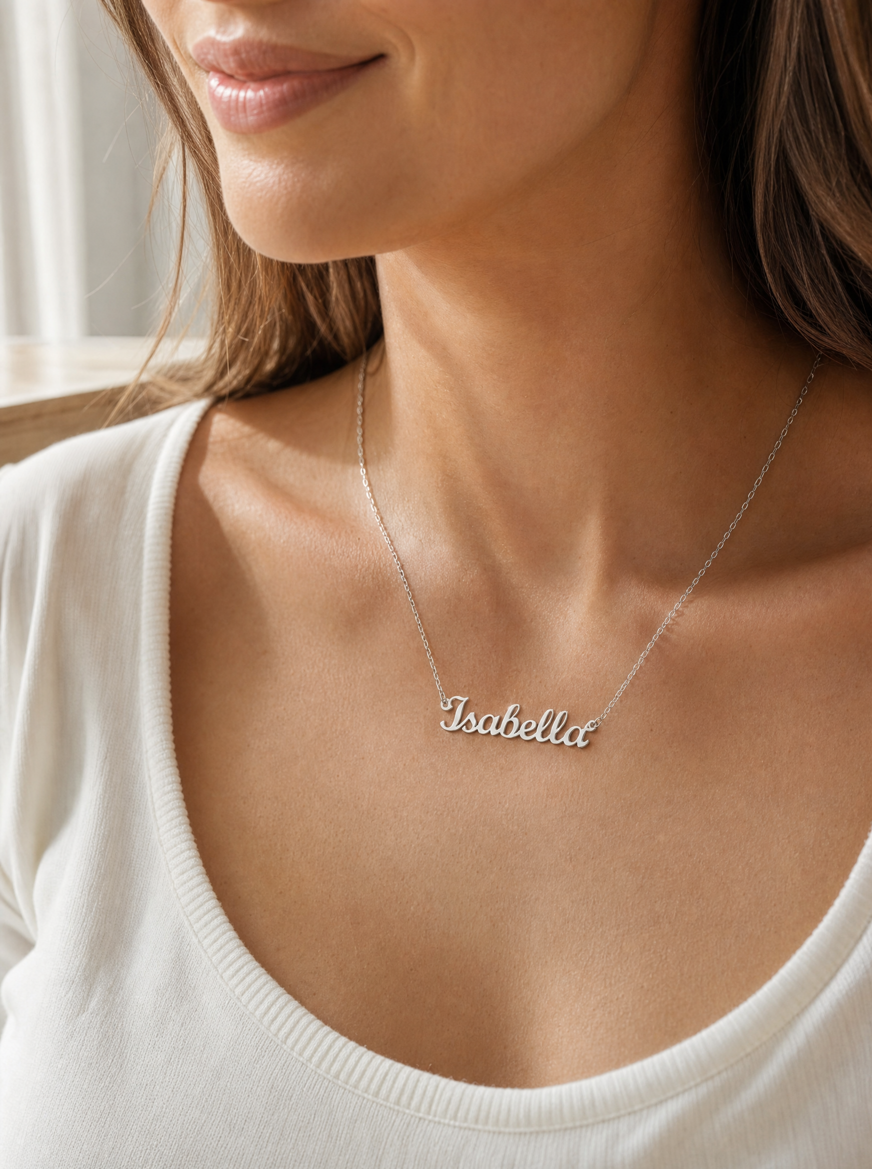 Woman wearing a personalized gold script name necklace