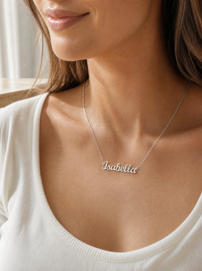 Woman wearing a personalized gold script name necklace
