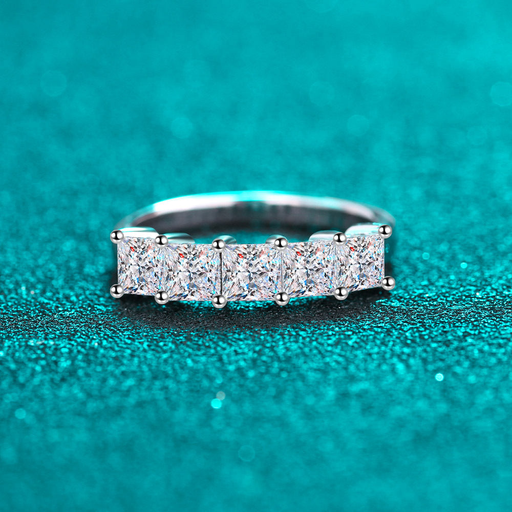 Stackable gold moissanite rings layered