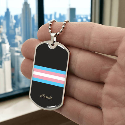 Trans pride stripe dog tag held up by a window | Subtle Trans Pride Dog Tag