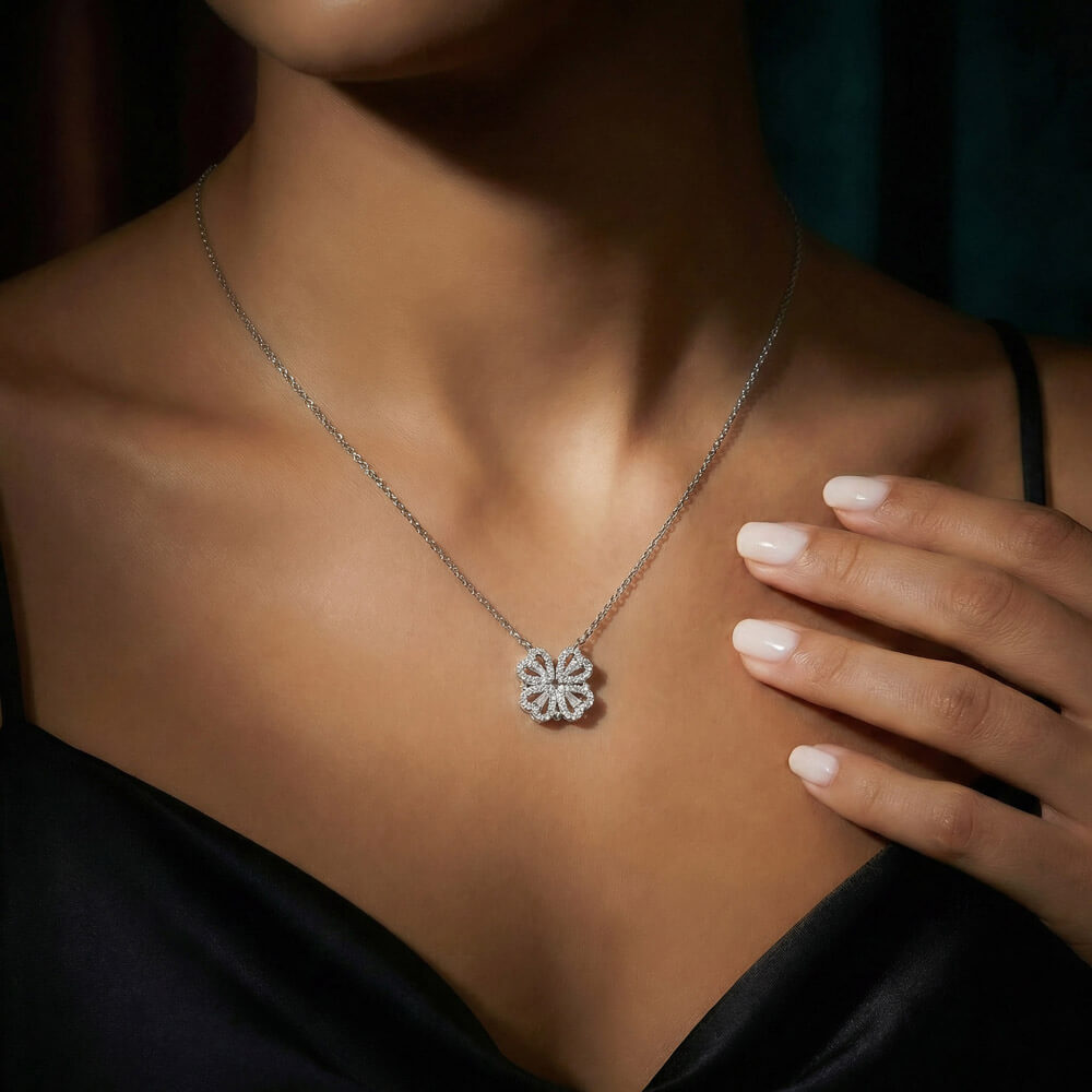 Clover pendant worn with a black top, close view | Magnetic Hearts Necklace