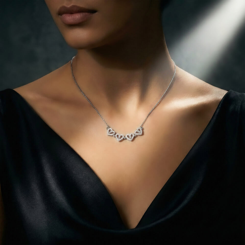 Row of hearts worn with a black top | Magnetic Hearts Necklace