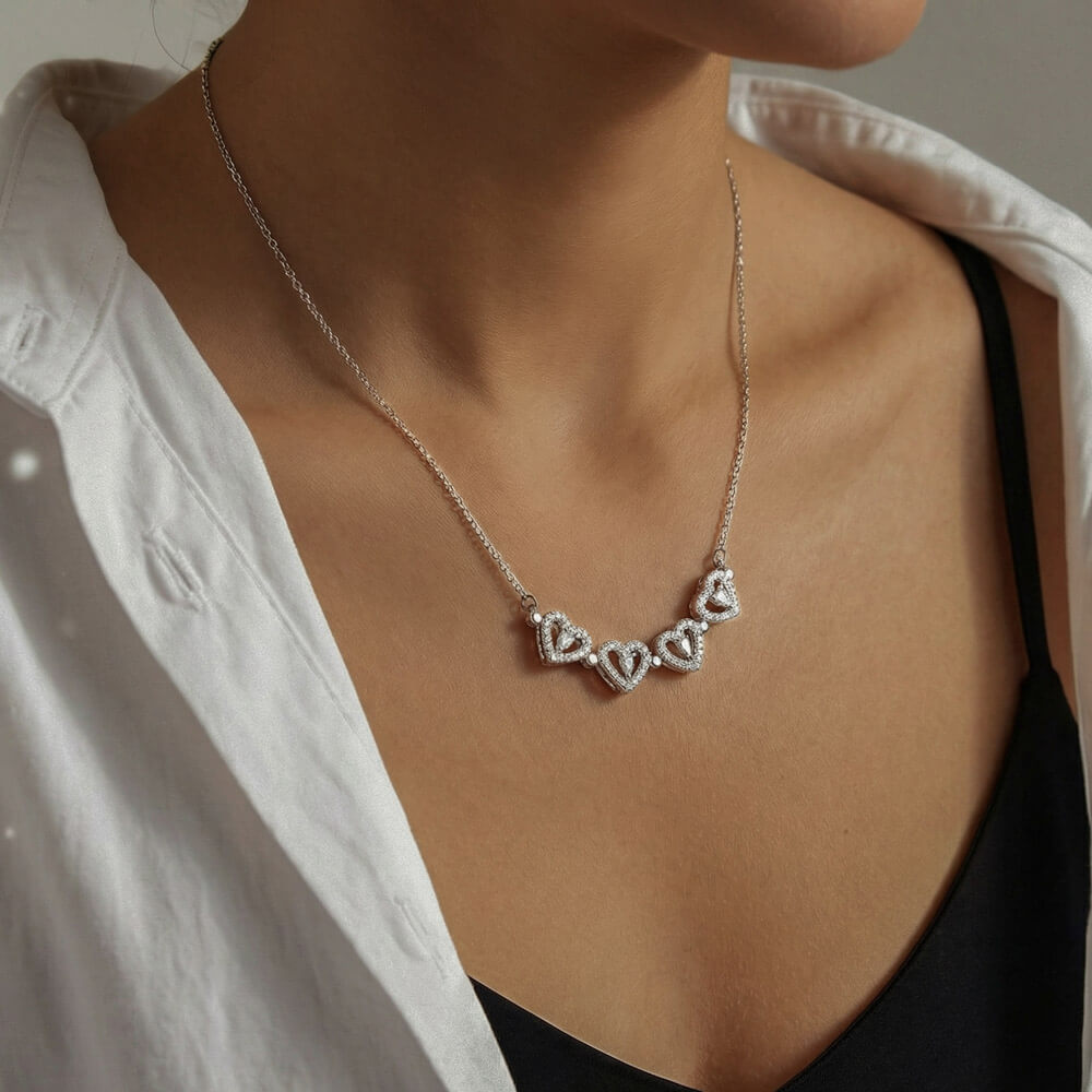 Row of hearts worn with a white robe | Magnetic Hearts Necklace