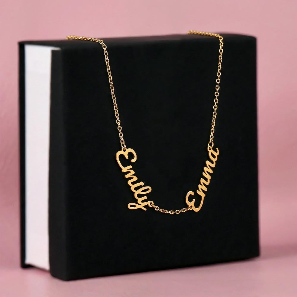 Gold finish two-name necklace draped over a black gift box | Multiple Name Necklace