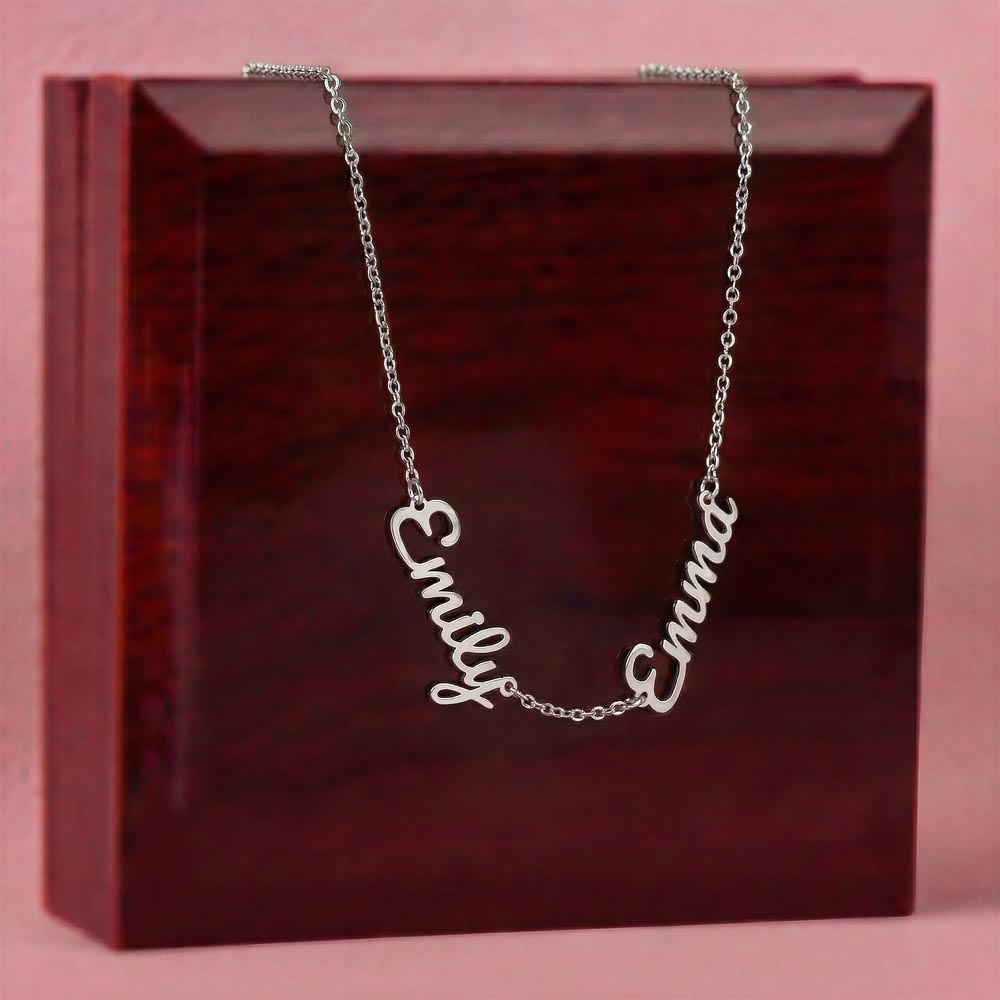 Steel two-name necklace draped over the mahogany Luxury Box | Multiple Name Necklace