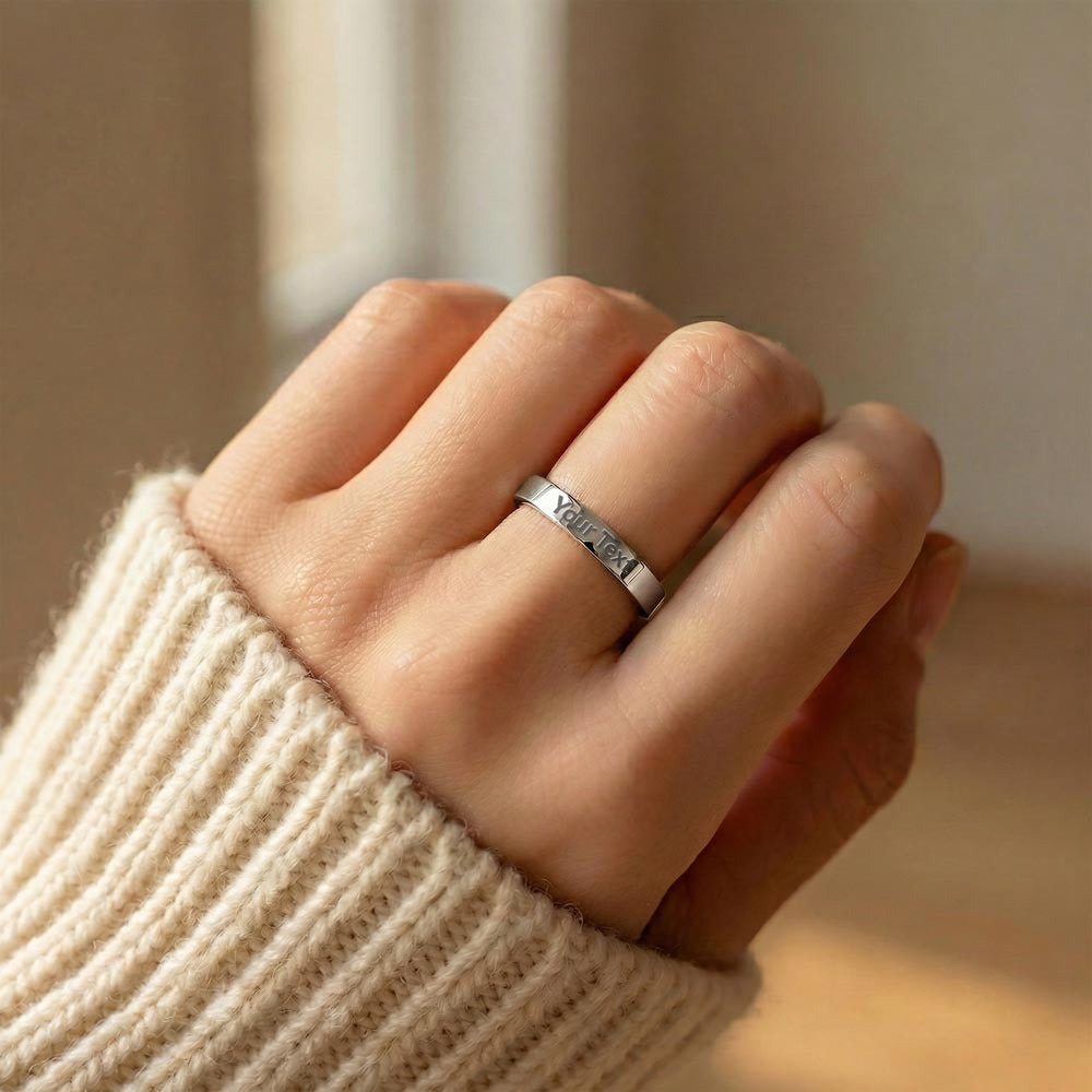 Stainless steel engraved ring worn with a knit sweater | Engraved Women's Ring