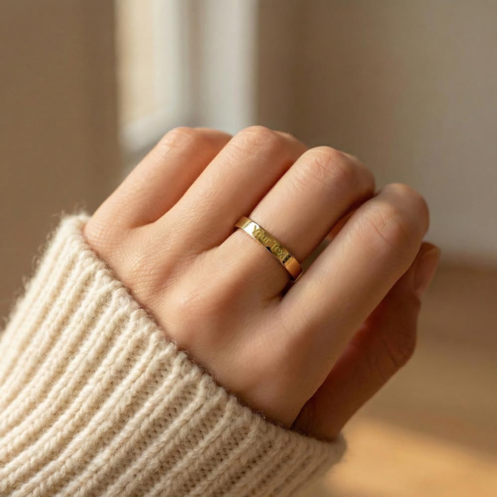 Gold finish engraved ring worn with a knit sweater | Engraved Women's Ring