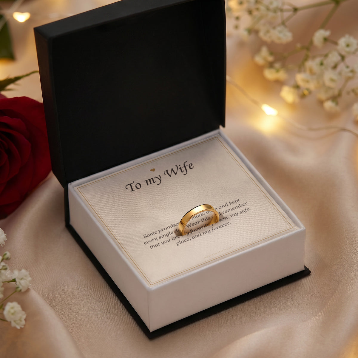 Gold finish ring and To My Wife card in an open gift box with warm lights | Engraved Ring for Wife with Message Card