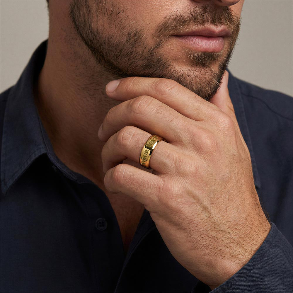 Man wearing the gold finish ring with his hand at his chin | Engraved Men's Ring
