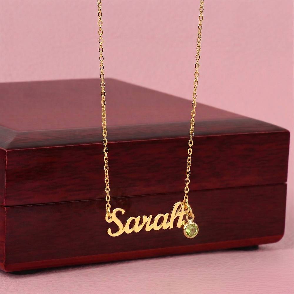 Gold finish name necklace with birthstone draped over the mahogany Luxury Box | Name Necklace with Birthstone