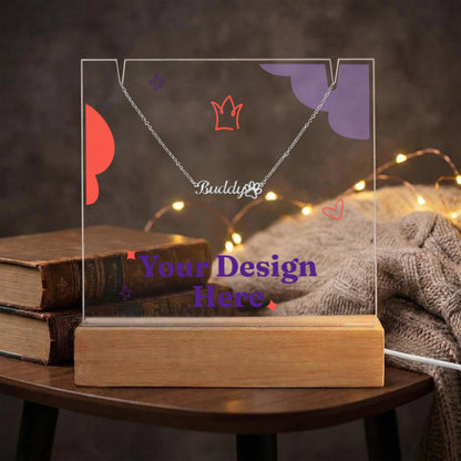 Acrylic keepsake and paw print name necklace on a stack of books with fairy lights | Pet Photo Keepsake Light and Paw Necklace