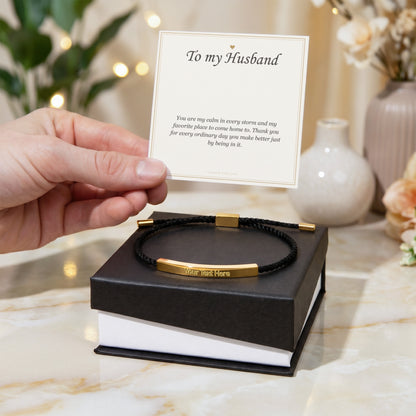Hand holding the open gift box with the gold finish bar bracelet | Engraved Bracelet for Husband with Message Card