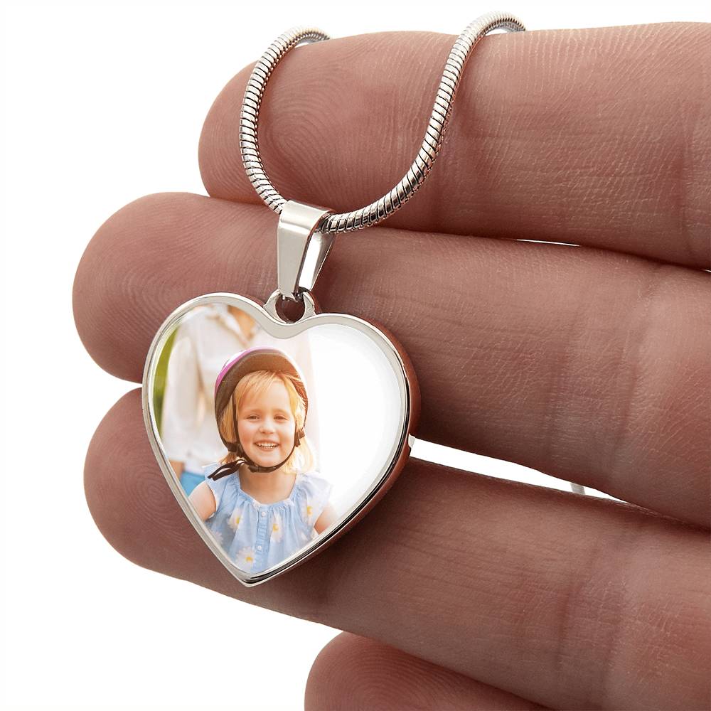 Hand holding the silver heart pendant printed with a sample photo | Custom Photo Heart Necklace with Engraving