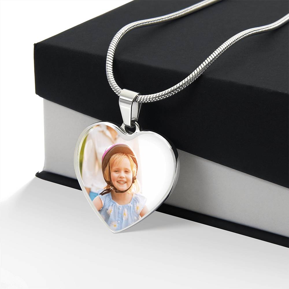 Silver photo heart pendant draped over a black gift box | Custom Photo Heart Necklace with Engraving