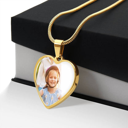 Gold finish photo heart pendant draped over a black gift box | Custom Photo Heart Necklace with Engraving