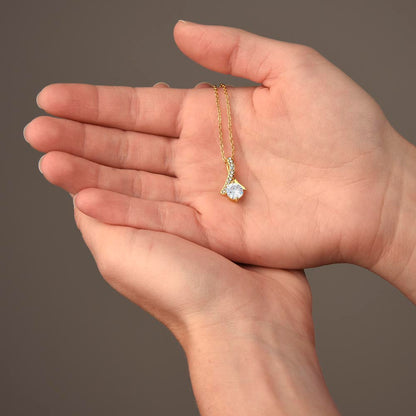 Open palm holding the white gold finish pendant | Proud Mom Necklace