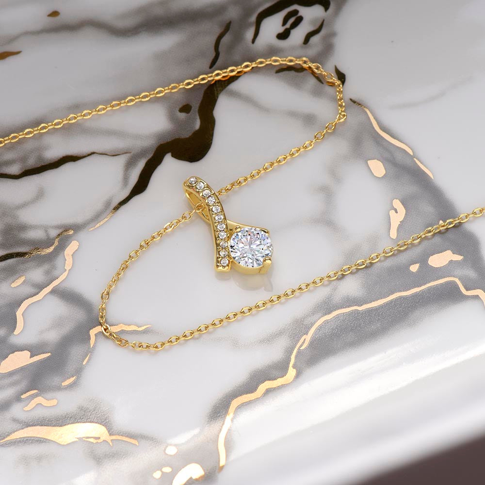 Yellow gold finish pendant and chain on white and gold marble | Proud Mom Necklace