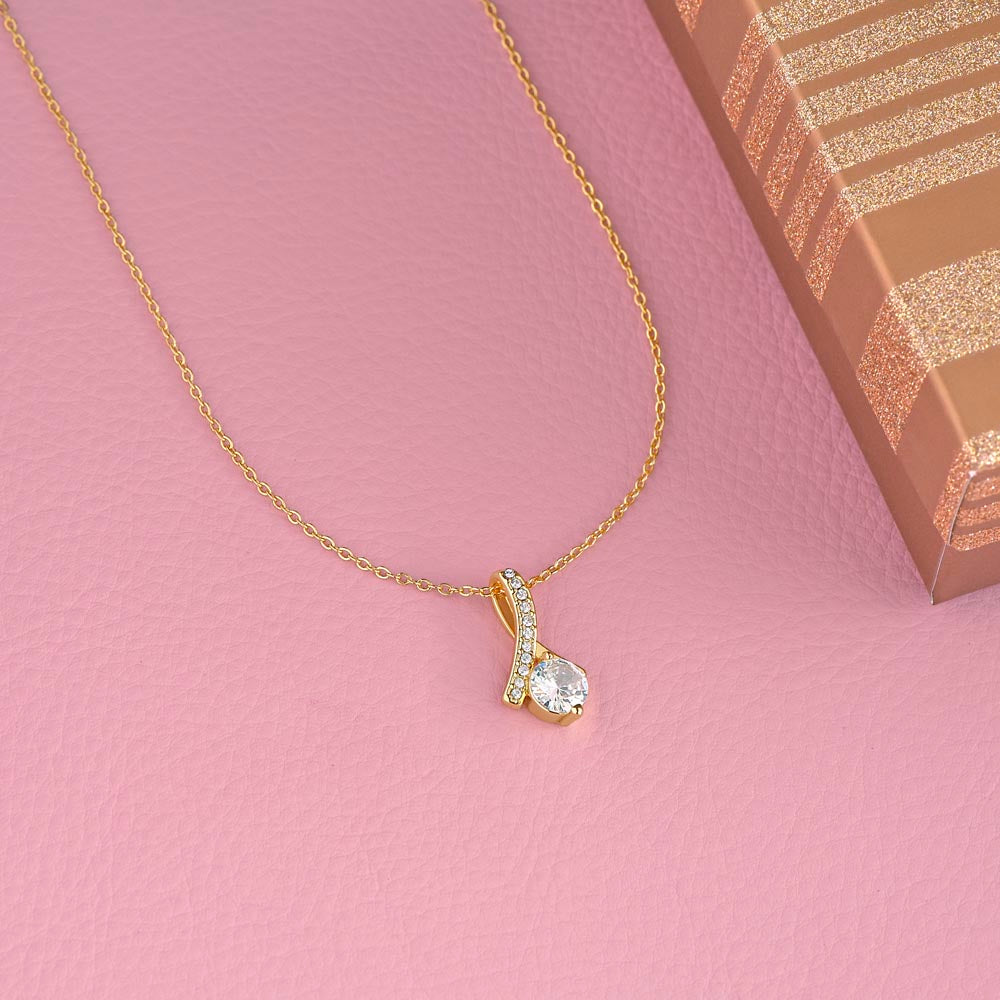 Yellow gold finish pendant on a pink background | Proud Mom Necklace