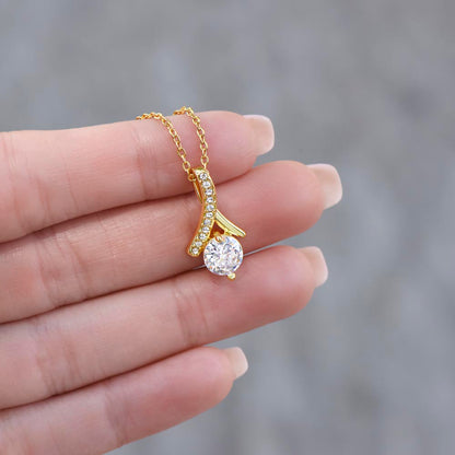 Fingers holding up the yellow gold finish pendant | Proud Mom Necklace