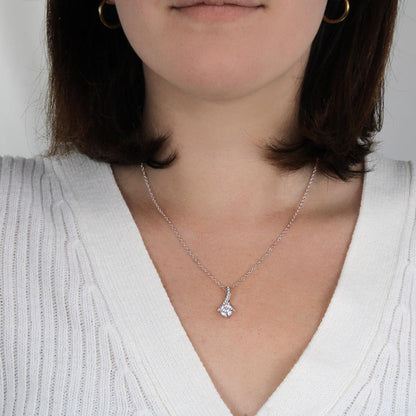 Woman in a white knit top wearing the white gold finish pendant | Proud Mom Necklace