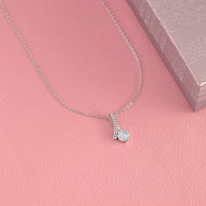 White gold finish pendant on a pink background beside its box | Proud Mom Necklace