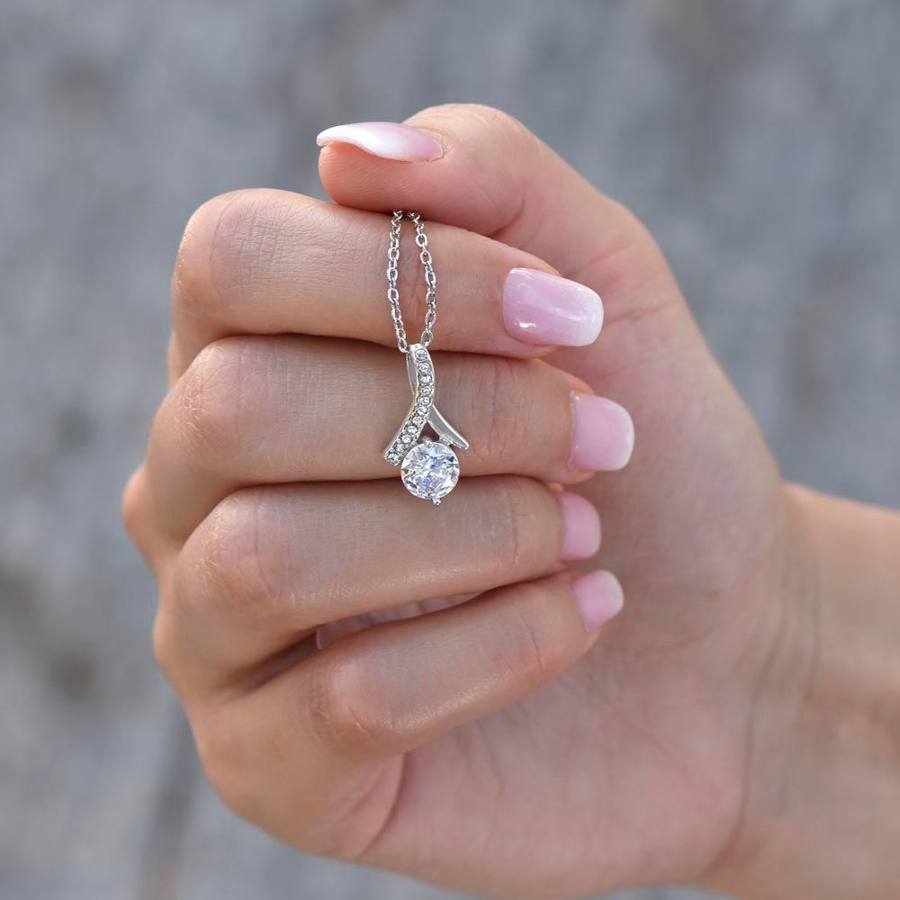 Hand cradling the white gold finish pendant | Proud Mom Necklace