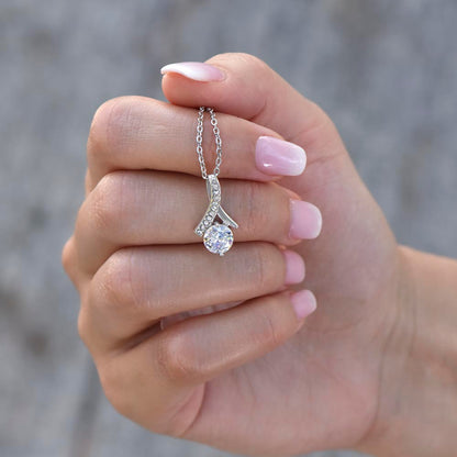 Hand cradling the white gold finish pendant | Proud Mom Necklace