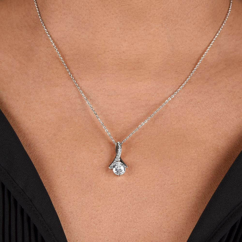 White gold finish pendant worn with a black top, close view | Proud Mom Necklace