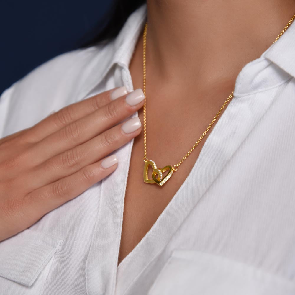 Woman in a white shirt touching the yellow gold finish pendant | Always Proud, Always Loved Necklace