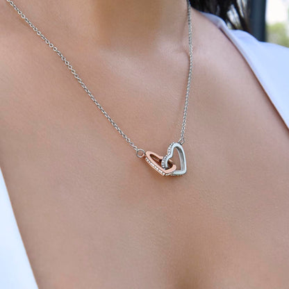 Interlocking hearts pendant worn at the neckline, close view | Always Proud, Always Loved Necklace