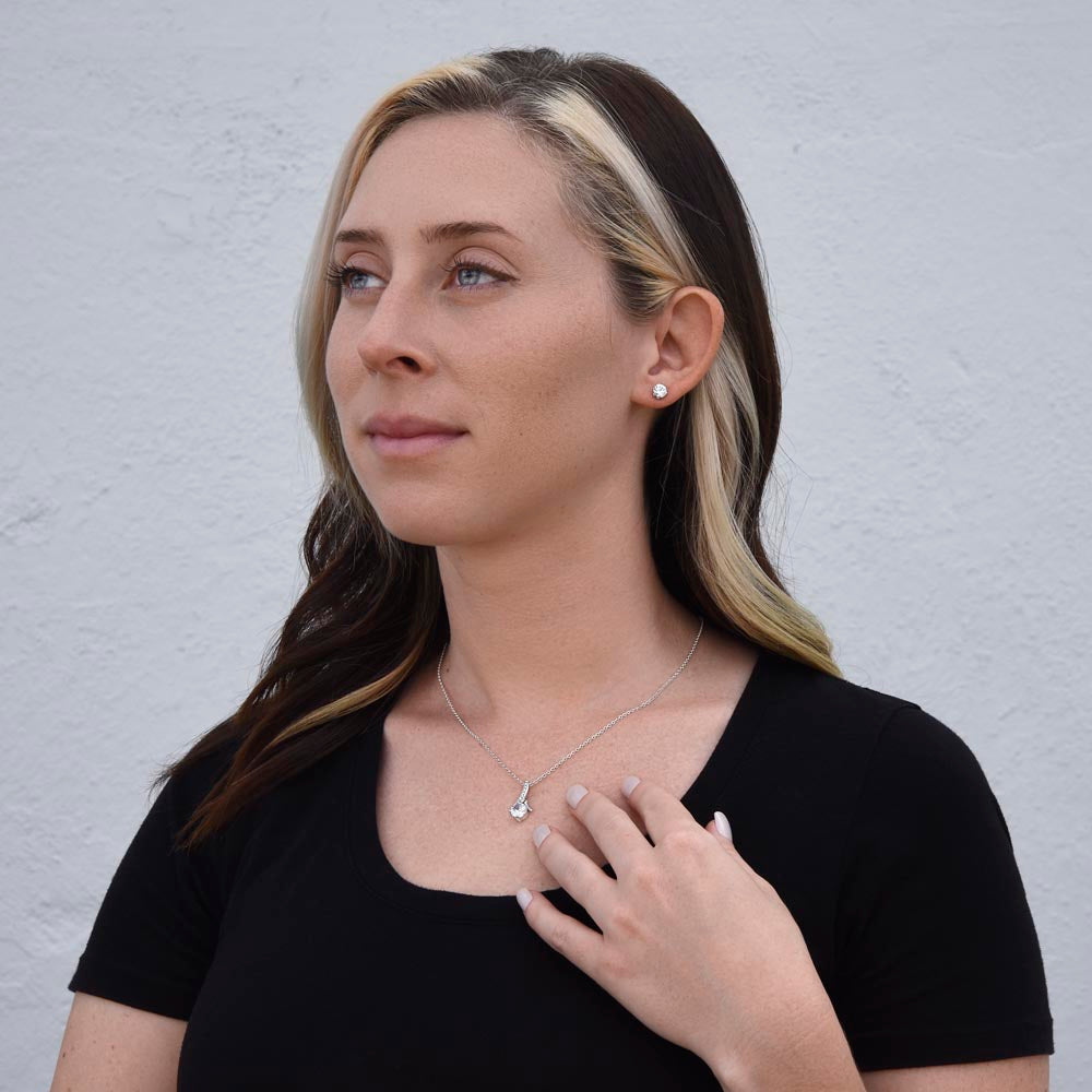 Woman touching the Alluring Beauty pendant | Alluring Beauty Necklace and Earring Set