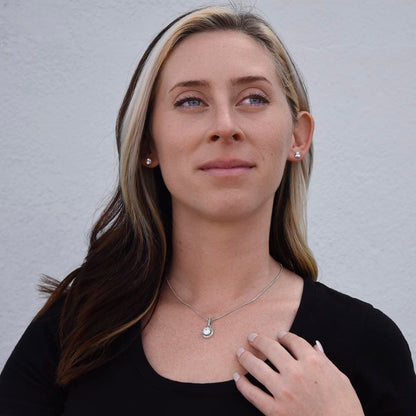 Woman in black wearing the Eternal Hope set | Eternal Hope Necklace and Earring Set
