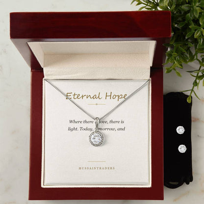 Eternal Hope set in the mahogany Luxury Box beside greenery | Eternal Hope Necklace and Earring Set