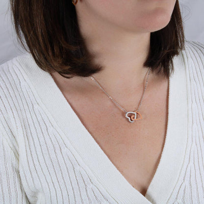 Woman in a white top wearing the interlocking hearts | Interlocking Hearts Necklace