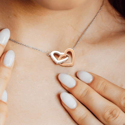 Steel and rose gold interlocking hearts worn at the collarbone | Interlocking Hearts Necklace