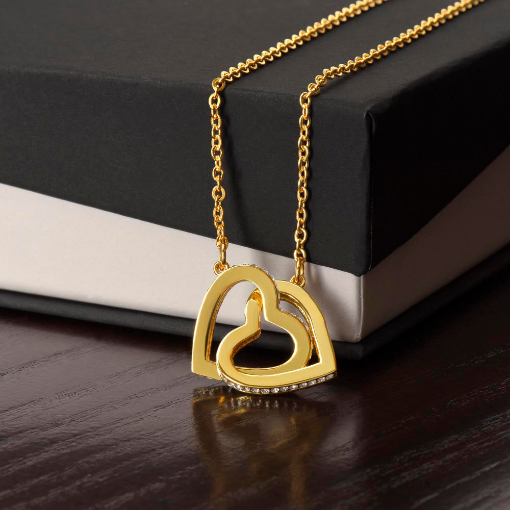 Yellow gold finish interlocking hearts draped over a black gift box | Interlocking Hearts Necklace