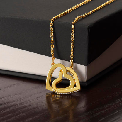 Yellow gold finish interlocking hearts draped over a black gift box | Interlocking Hearts Necklace
