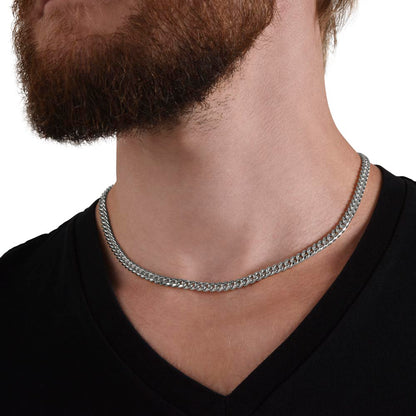 Man in a black tee wearing the steel Cuban chain, close view | Cuban Link Chain