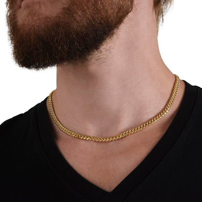 Gold finish Cuban chain worn with a black tee | Cuban Link Chain
