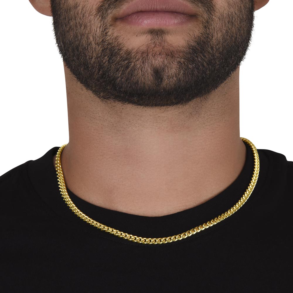 Gold finish Cuban chain worn with a black tee, front view | Cuban Link Chain