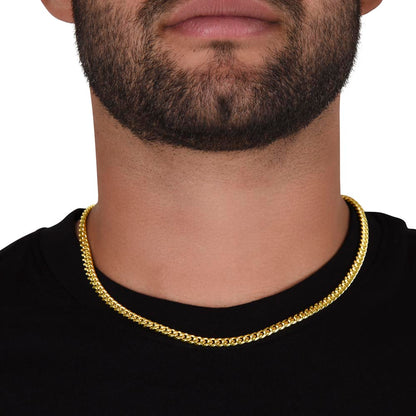 Gold finish Cuban chain worn with a black tee, front view | Cuban Link Chain
