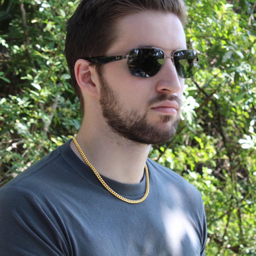 Man in sunglasses wearing the gold finish chain outdoors | Cuban Link Chain