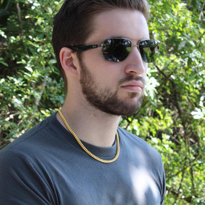 Man in sunglasses wearing the gold finish chain outdoors | Cuban Link Chain
