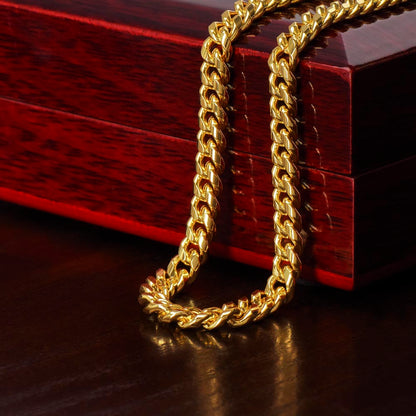 Gold finish Cuban chain draped over the mahogany Luxury Box | Cuban Link Chain